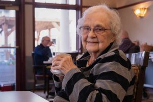 assisted living st paul Minnesota woman enjoying hot beverage